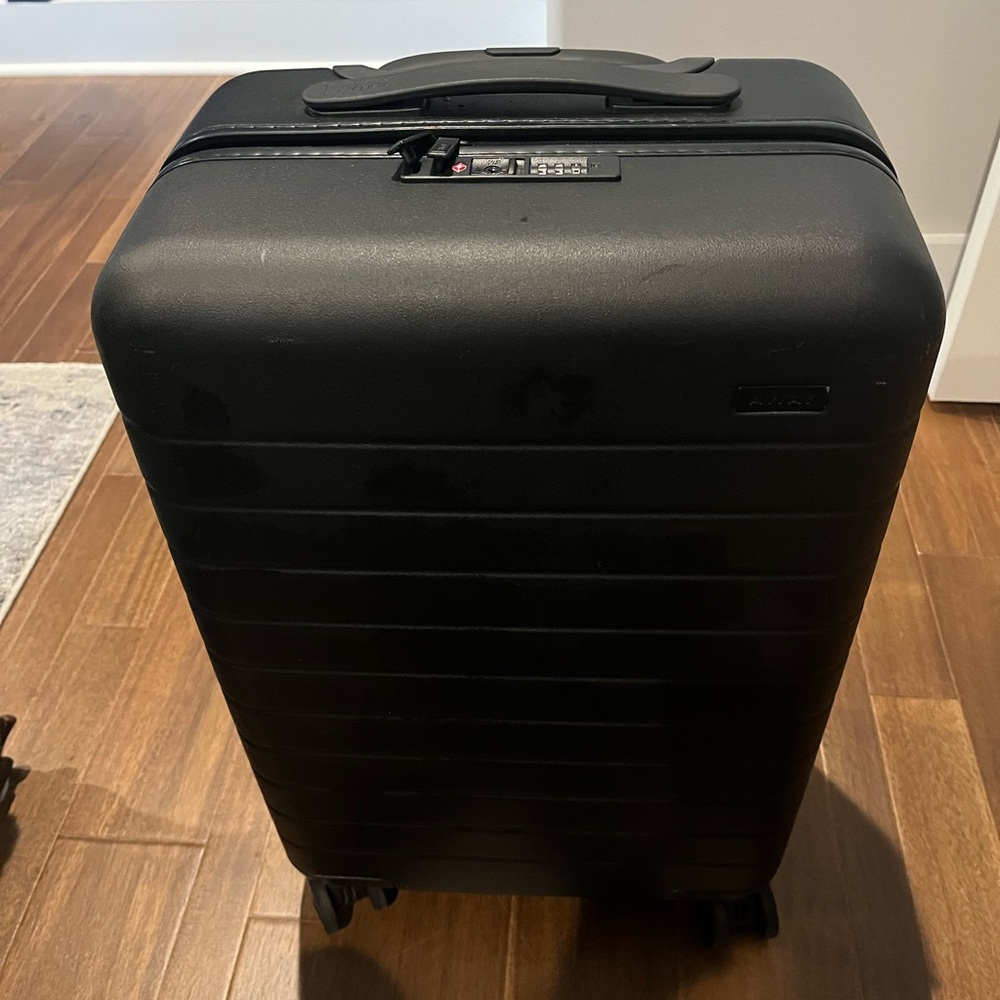 SOLD Away the Bigger Carry-on black w battery pack included.
